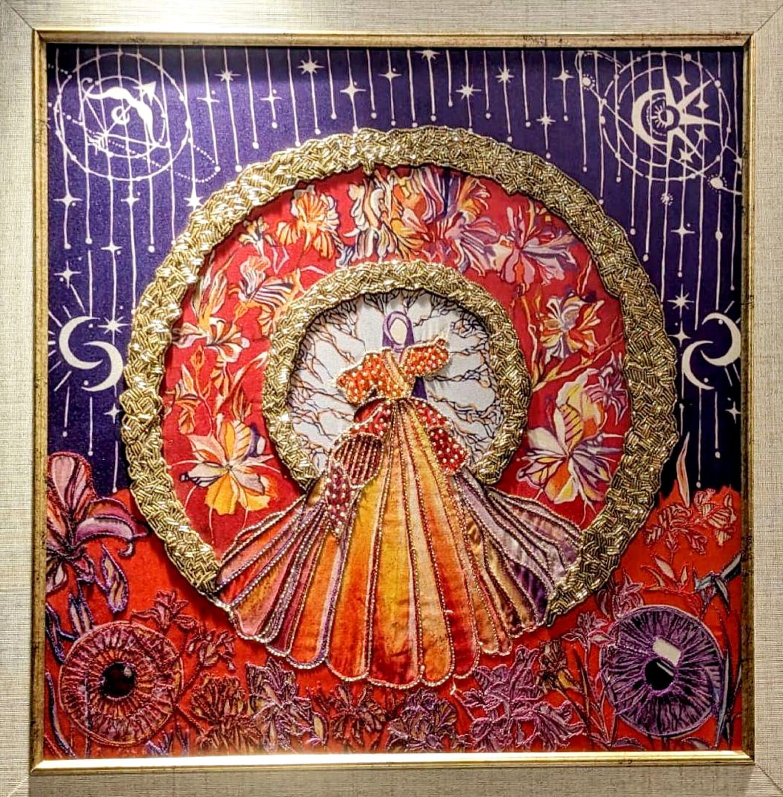 Beaded and embroidered halo figure on red and violet ground